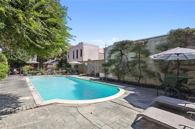 view of pool featuring a patio