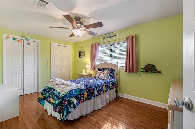 bedroom featuring hardwood / wood-style floors and ceiling fan