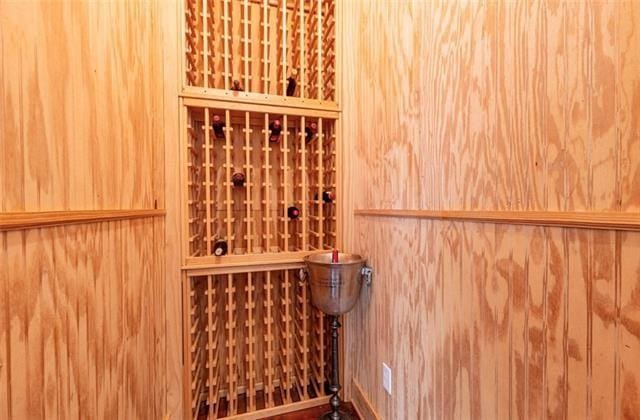 wine room with wood walls