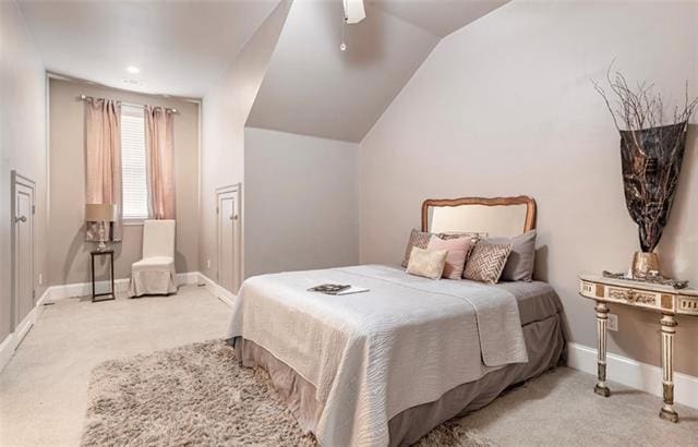 carpeted bedroom featuring ceiling fan and lofted ceiling