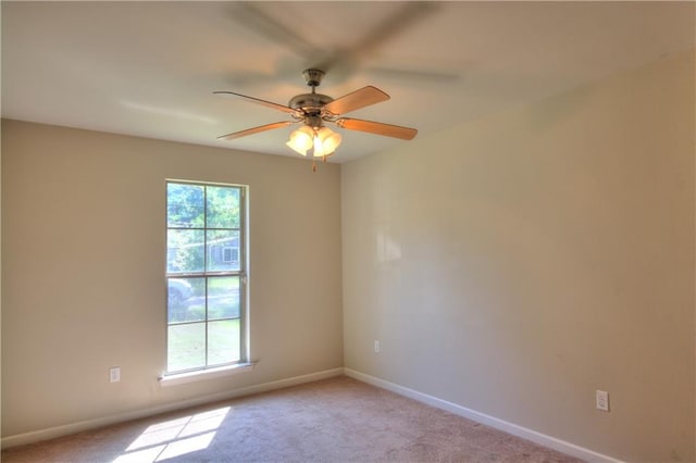 unfurnished room with light carpet and ceiling fan