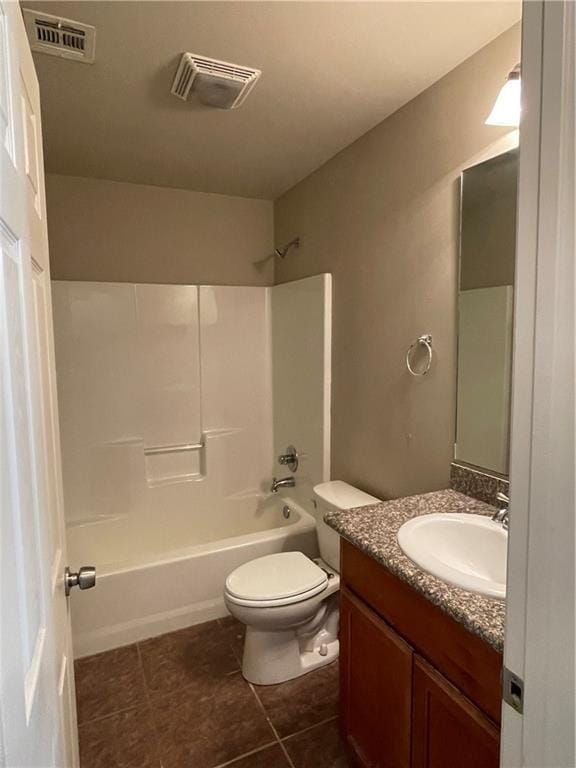 full bathroom with shower / tub combination, tile patterned flooring, vanity, and toilet