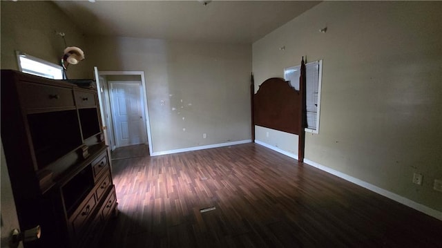 empty room featuring dark hardwood / wood-style flooring