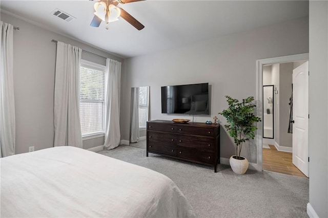 carpeted bedroom with ceiling fan