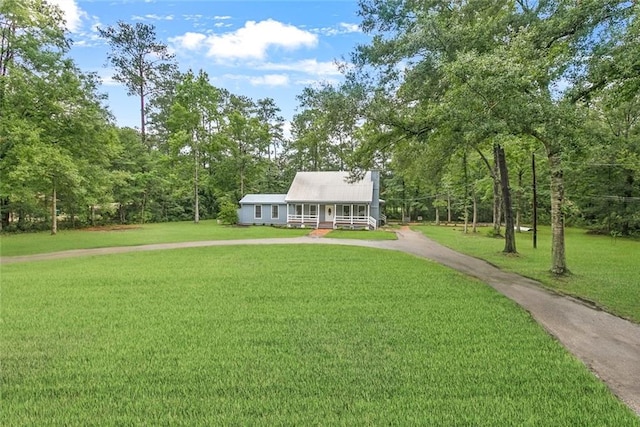 view of front of house with a front lawn and covered porch