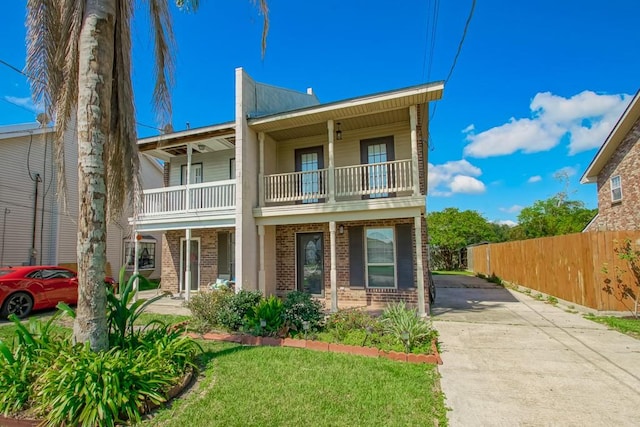 view of front of home with a balcony