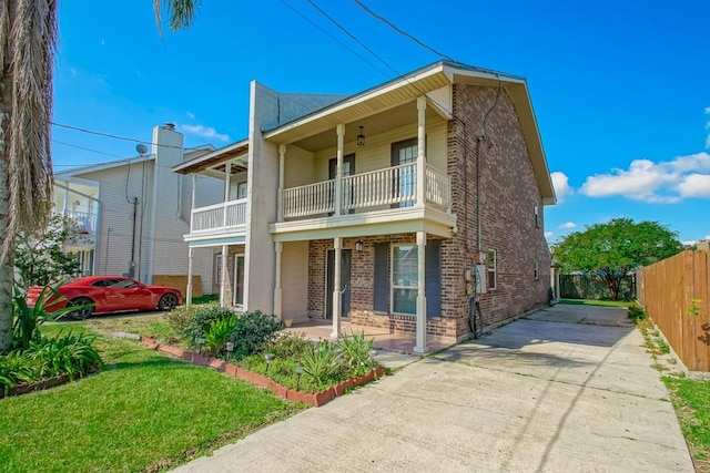 view of front of property with a balcony