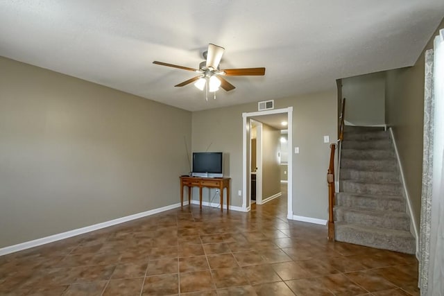 unfurnished living room with tile patterned flooring and ceiling fan