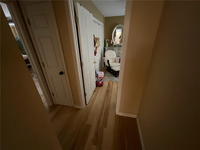 corridor featuring light hardwood / wood-style flooring