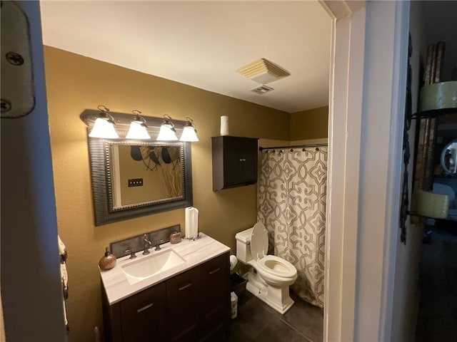 bathroom featuring a shower with curtain, vanity, toilet, and tile patterned floors