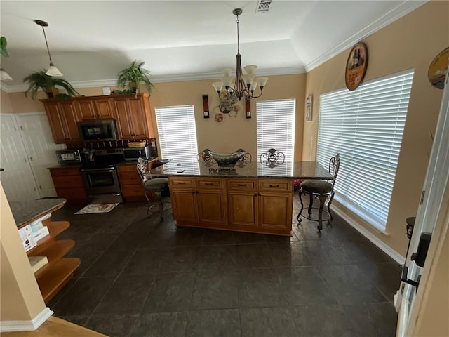 kitchen featuring ornamental molding, stainless steel appliances, a center island, and decorative light fixtures