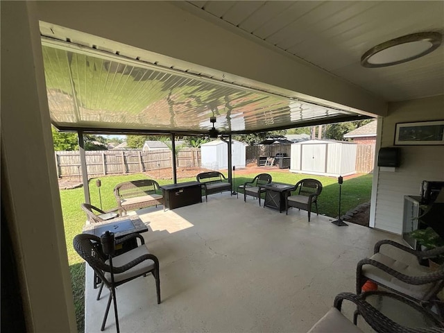 view of patio / terrace with a shed