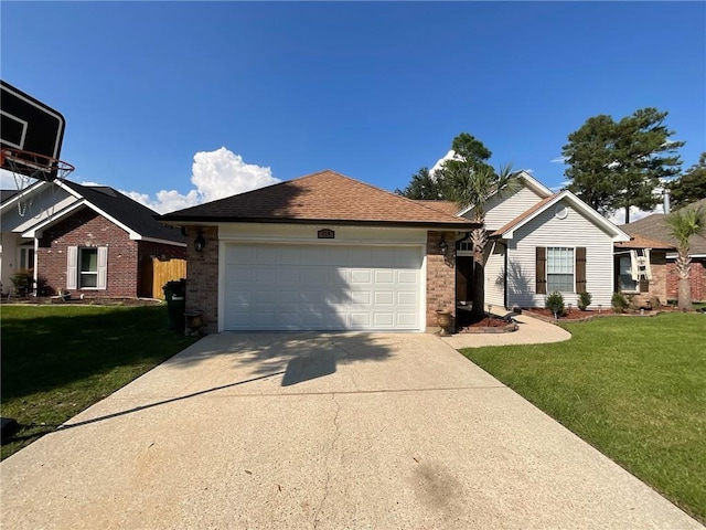 view of front of property with a front yard and a garage