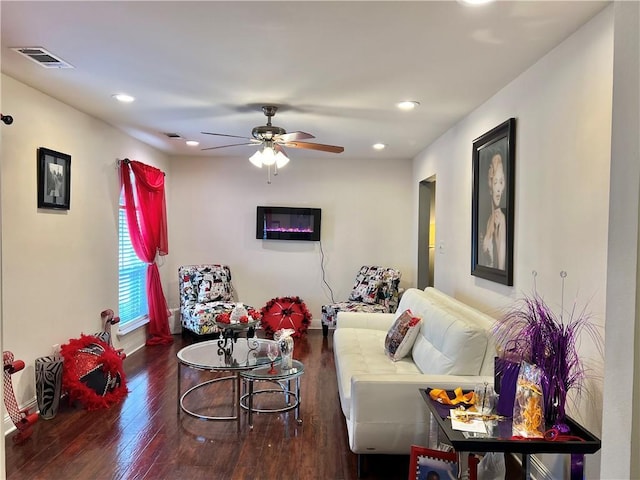 living room with hardwood / wood-style floors and ceiling fan