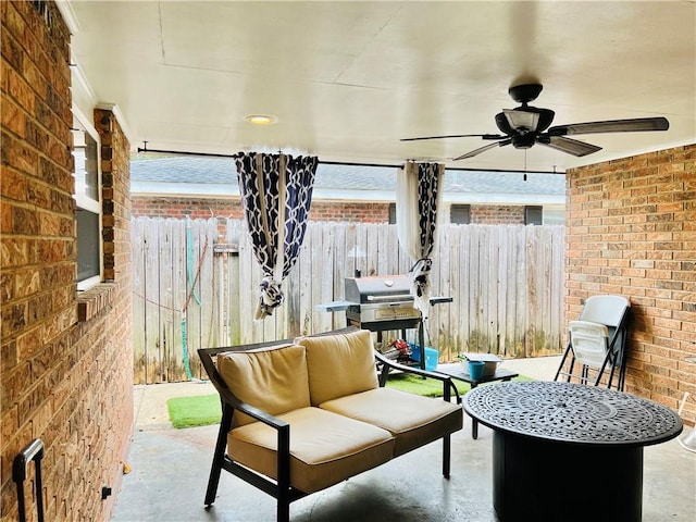 interior space with ceiling fan and area for grilling