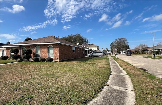 view of property exterior with a yard