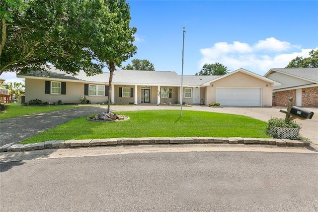 ranch-style home featuring a garage and a front yard