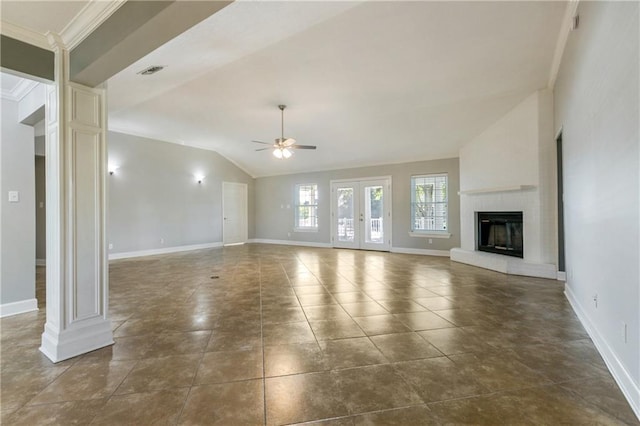 unfurnished living room with ceiling fan, a large fireplace, ornamental molding, and vaulted ceiling