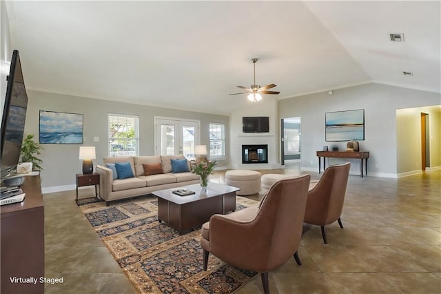 tiled living room with ornamental molding, ceiling fan, and lofted ceiling