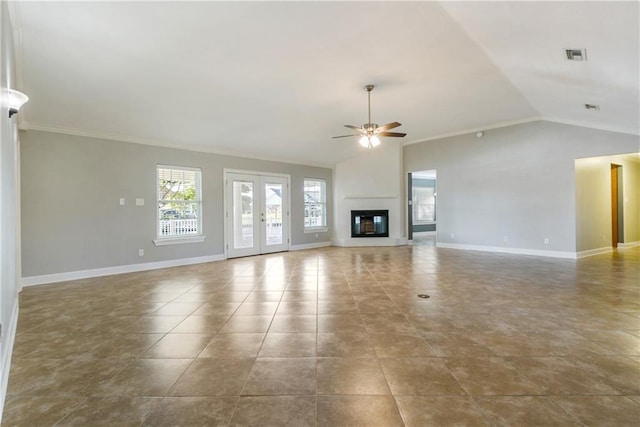 unfurnished living room featuring tile patterned floors, vaulted ceiling, ceiling fan, and crown molding