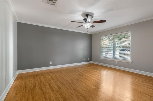 unfurnished room featuring crown molding, hardwood / wood-style floors, and ceiling fan