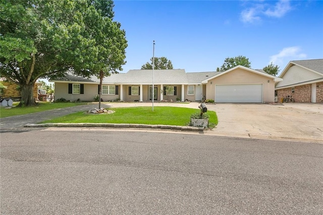 ranch-style house with a garage and a front lawn