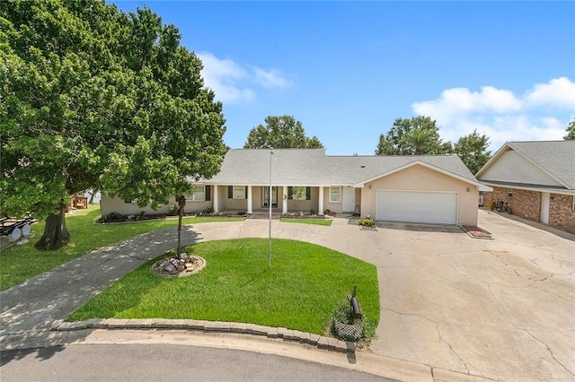 ranch-style home with a garage and a front lawn