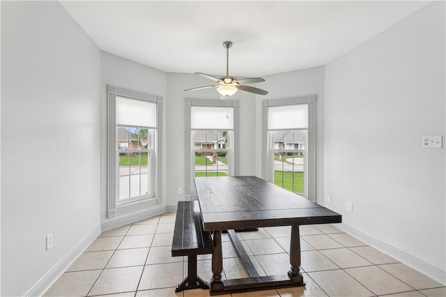 dining area featuring light tile patterned flooring, ceiling fan, and a wealth of natural light