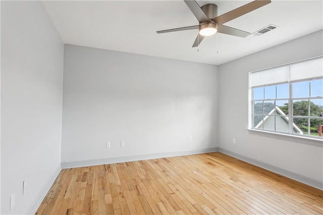 empty room with ceiling fan and light wood-type flooring