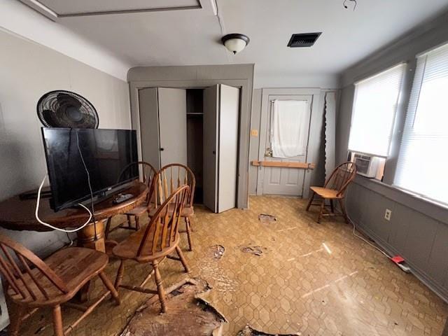 office area featuring cooling unit and visible vents