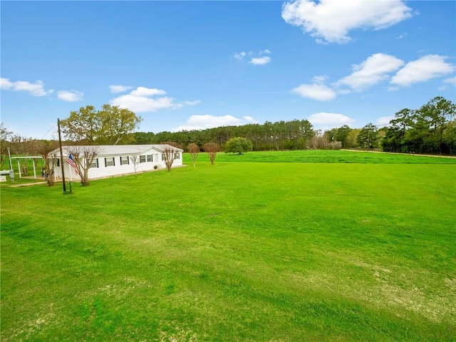 view of yard with a rural view