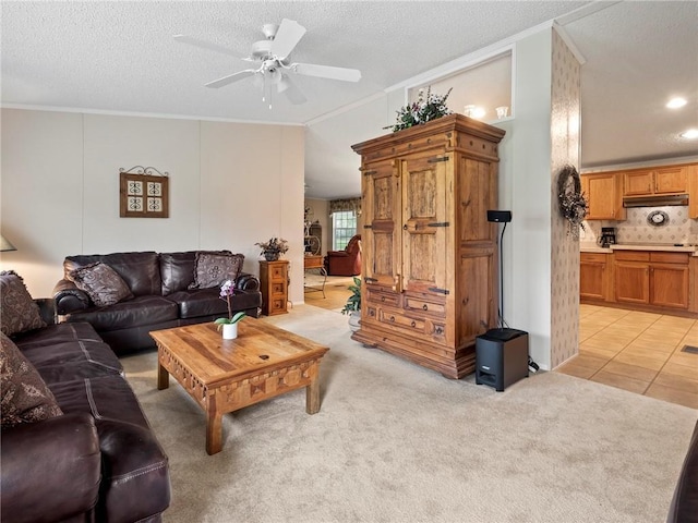 carpeted living room with crown molding, ceiling fan, and a textured ceiling