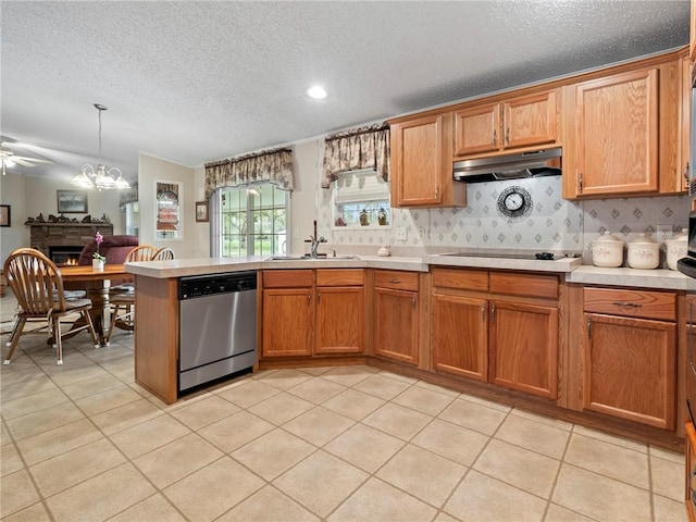 kitchen featuring sink, dishwasher, hanging light fixtures, light tile patterned flooring, and black electric cooktop