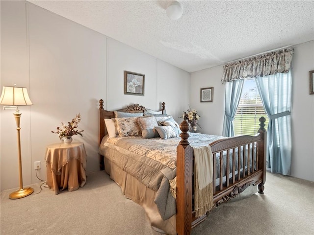 carpeted bedroom featuring lofted ceiling and a textured ceiling