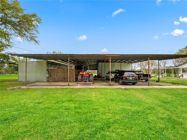 view of vehicle parking featuring a lawn