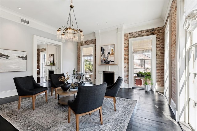 living area with plenty of natural light, dark hardwood / wood-style flooring, and crown molding