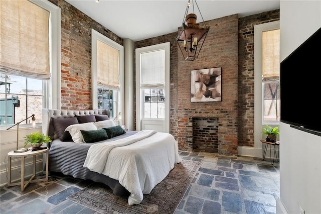 bedroom with brick wall