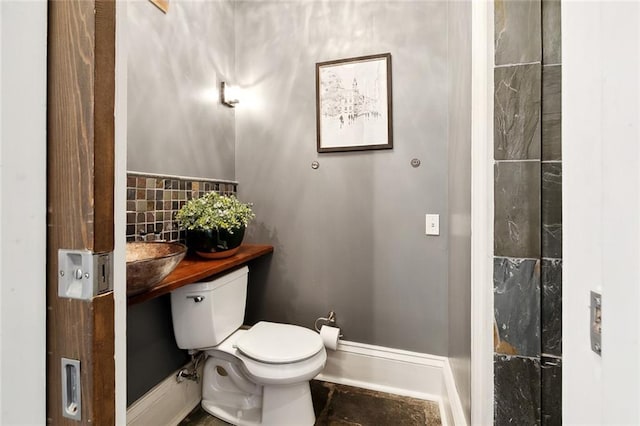 bathroom featuring sink and toilet