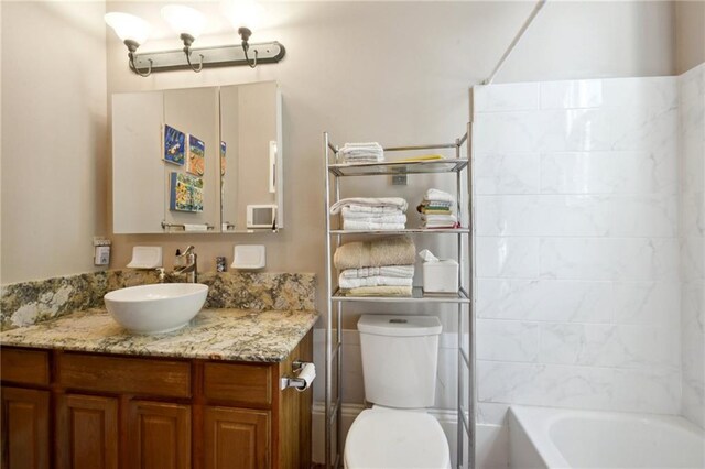 full bathroom with vanity, toilet, and bathtub / shower combination