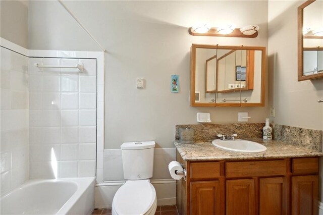 full bathroom featuring vanity, shower / bath combination, tile patterned flooring, and toilet