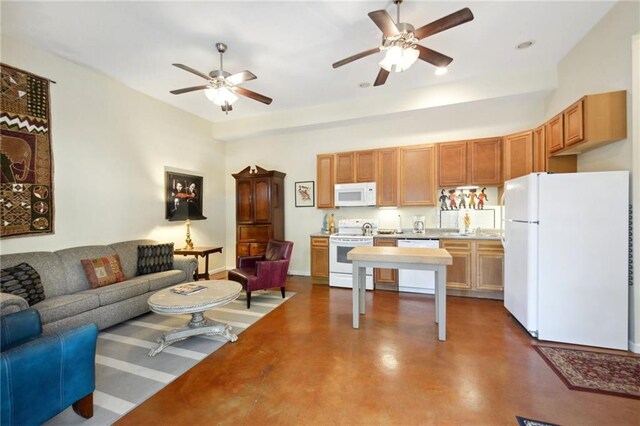 kitchen featuring white appliances and ceiling fan