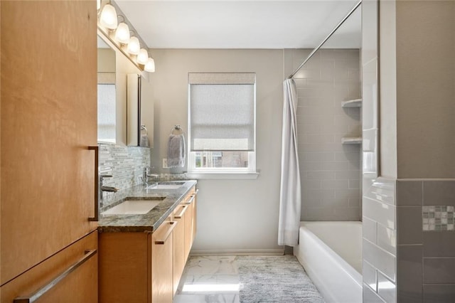 bathroom with vanity and shower / bath combination with curtain