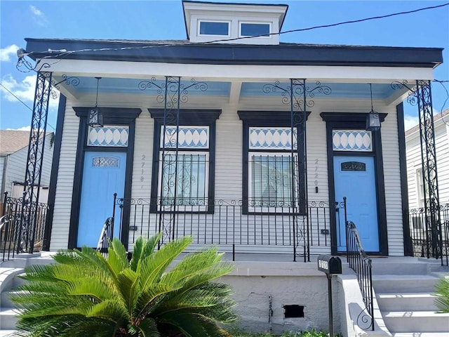 property entrance with covered porch