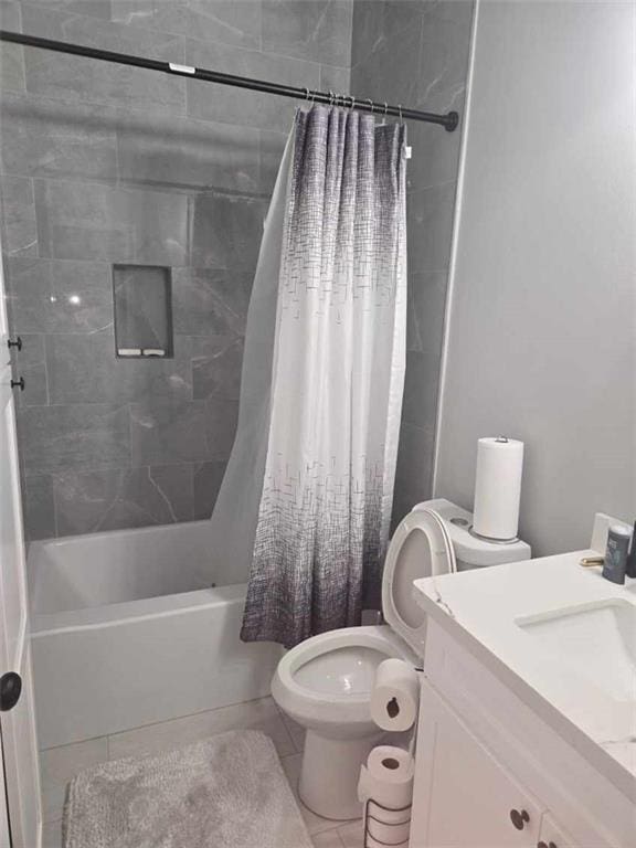 full bathroom featuring shower / bathtub combination with curtain, tile patterned flooring, vanity, and toilet