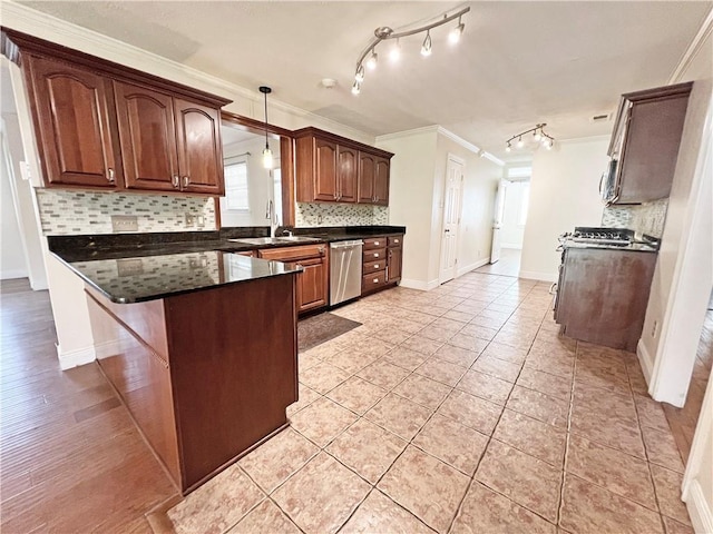 kitchen featuring decorative backsplash, stainless steel appliances, ornamental molding, and sink