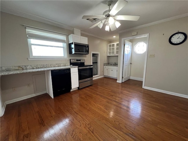 kitchen with appliances with stainless steel finishes, white cabinetry, ceiling fan, and dark wood-type flooring