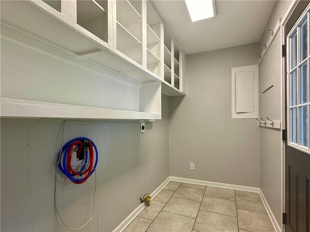 laundry area featuring light tile patterned flooring