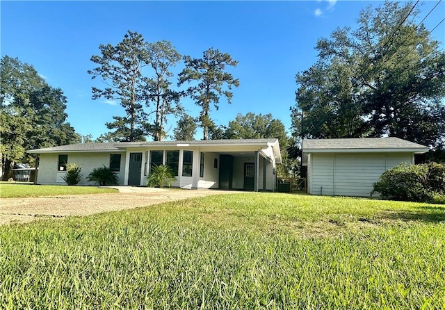 ranch-style house with a front lawn and a carport