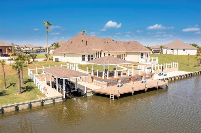 view of dock featuring a yard and a water view