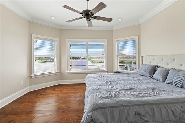 bedroom with dark hardwood / wood-style flooring, ornamental molding, and ceiling fan